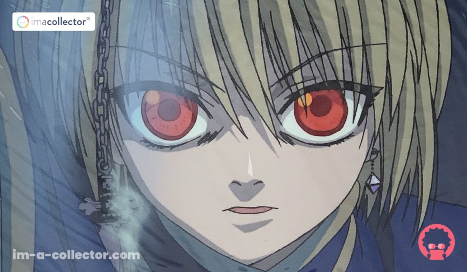 Rilezu officiel de Kurapika au regard déterminé, avec chaîne visible au premier plan, issu de l’anime Hunter × Hunter de 1999.