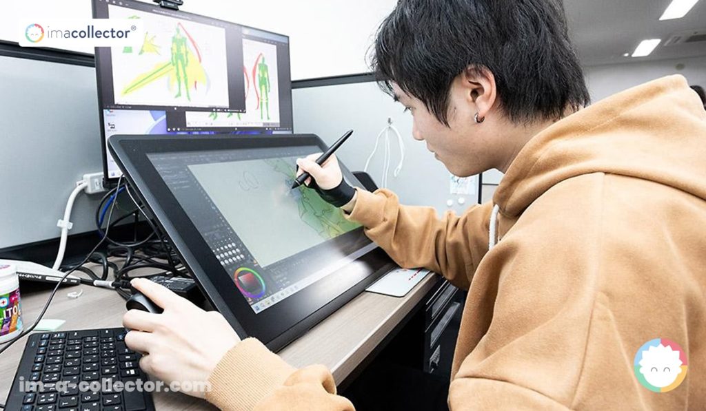 A-1 Picturesのアニメーターがタブレットで作業し、その手前には制作資料としての設定資料が並べられている。